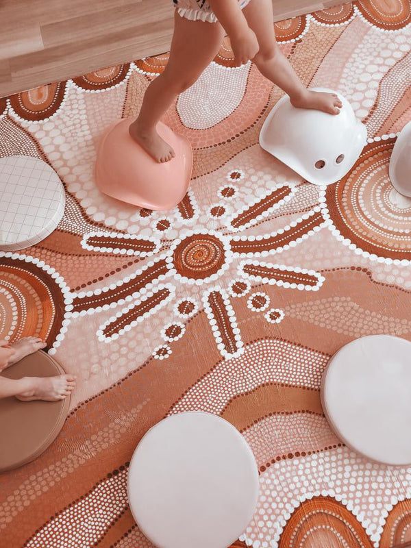 A colorful playroom showcasing an array of toys and a spacious window for sunlight.