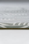 Detailed view of a white and grey patterned surface, showcasing intricate textures and soft color contrasts.