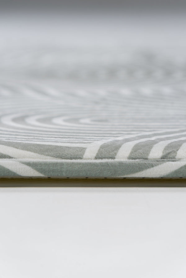 Detailed view of a white and grey patterned surface, showcasing intricate textures and soft color contrasts.